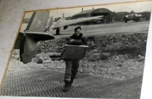 On ramp at Attu in 1944,  VP-131 navigator for pilot Bob Feiten brings charts to aircraft prior to mission against Japan.
